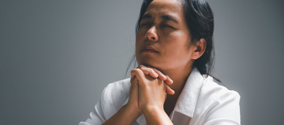 woman focus on her prayer