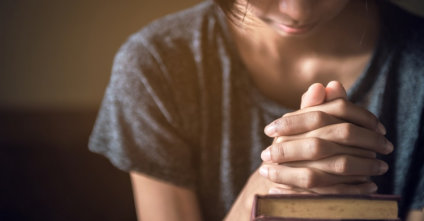 a person praying alone