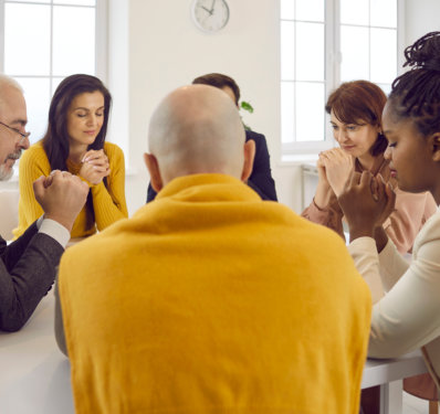 group of people praying together