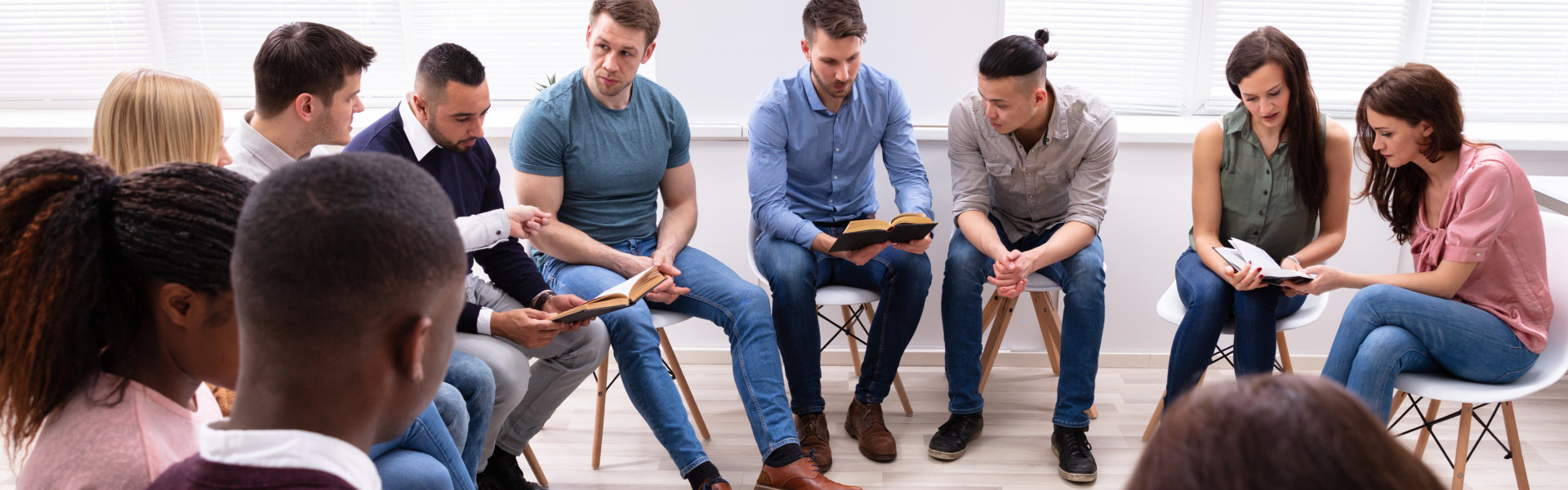 group of people reading bible