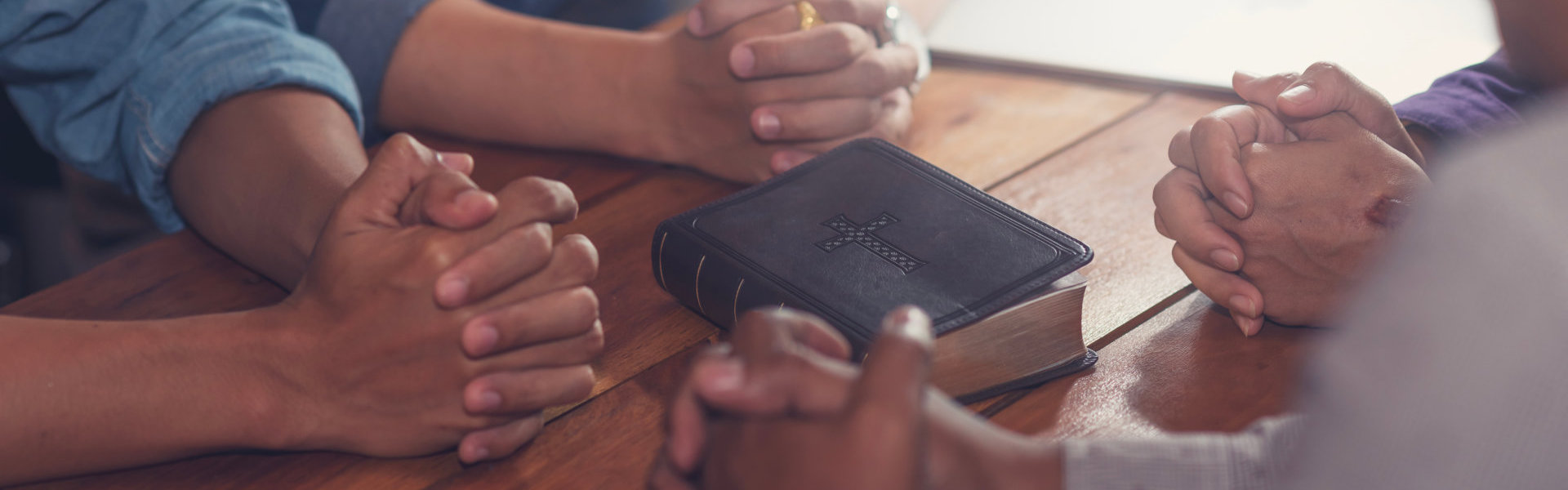 group of people praying together