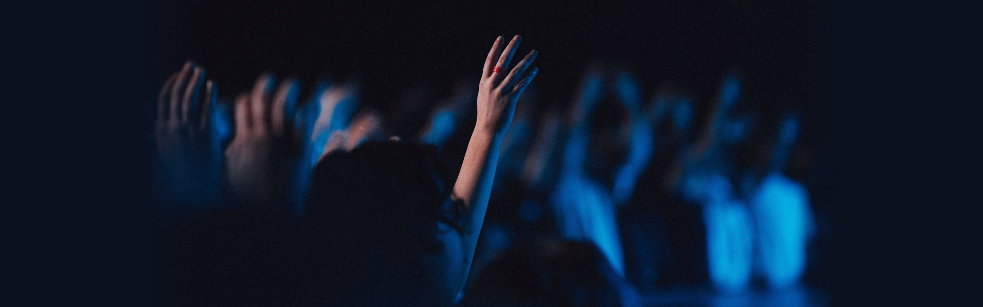people raising hands an act of worshiping God